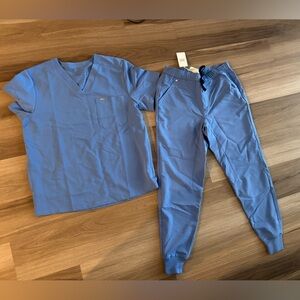 Men’s ceal blue Figs scrubs top size L joggers size M. Sold together or separate